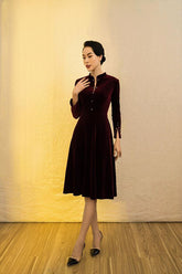 Elegant velvet midi dress with mandarin collar and pearl button details